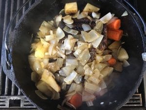 add the rest of the vegetables on top to flavor the top of the post roast and keep moisture in the meat
